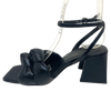 <p>Soft leather knots feature on this on trend black sandal from Brazilio. The flared curved heel and square toe shape set it apart from the rest. You'll look and feel good for so many occasions in these.</p> <p>Made in Brazil.&nbsp;</p>