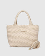 The Louenhide Baby Cruiser Malt Woven Tote Bag is the epitome of laid-back elegance. To elevate a past season favourite, the Cruiser, this women's woven tote bag will add the perfect touch of texture to your capsule wardrobe. Simply carry by the comfortable top handles or attach the adjustable crossbody strap for a hands-free moment when strolling around town. Elevate your style and carry your essentials with the Baby Cruiser Malt Woven