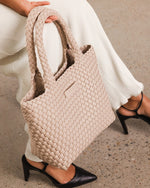 The Louenhide Baby Cruiser Malt Woven Tote Bag is the epitome of laid-back elegance. To elevate a past season favourite, the Cruiser, this women's woven tote bag will add the perfect touch of texture to your capsule wardrobe. Simply carry by the comfortable top handles or attach the adjustable crossbody strap for a hands-free moment when strolling around town. Elevate your style and carry your essentials with the Baby Cruiser Malt Woven