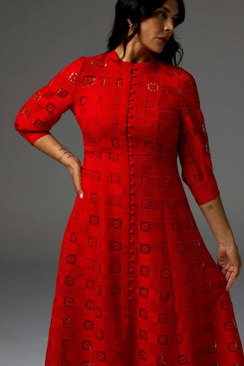 Embodying the season’s signature trend of red, the Beguile Dress in fire is both bold and feminine. With all-over lace detailing and covered buttons that run down the midi silhouette, this piece channels international runway and timeless allure.&nbsp;

Three-quarter blouson sleeves balance the look for refined elegance.

*please note, cami slip not included