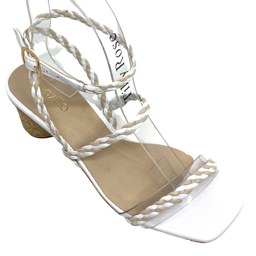 Made in Brazil, this summer sandal has a 6.5cm cylindrical shaped heel wrapped in jute. The straps are plaited leather of white and nude. The strap across the toes is the same width as the other straps however it is stitched to a clear band therefore offering the comfort of width.