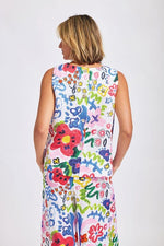 This brightly coloured "hand painted look" floral print on 100% linen is fresh and summery in this sleeveless top with round neck and buttons down the back. The fabric is also available in drawstring wide pants for a very current look.