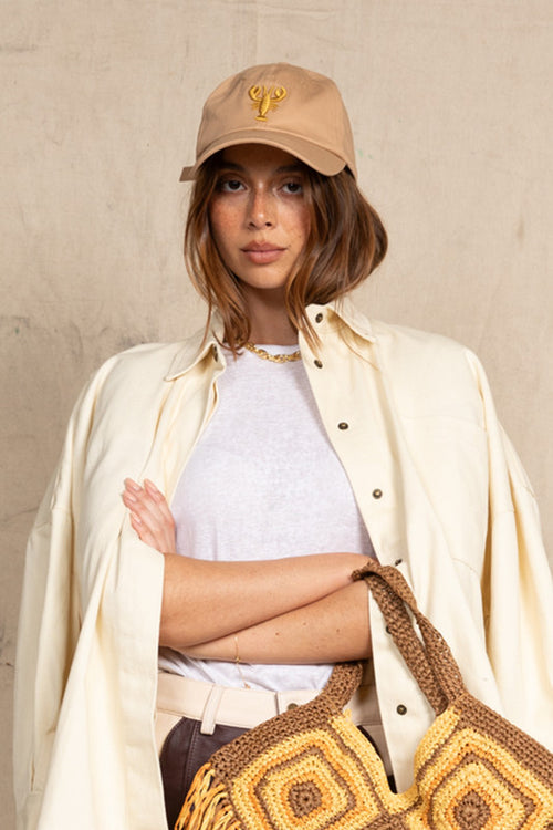 Bohemian Traders' baseball cap makes any outfit you wear it with effortlessly cool. Embroidered with a playful lobster, it's made from cotton-canvas and has an adjustable fastening tab at the back.