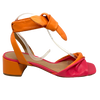 The soft leather and medium block heel make these little sandals a comfortable summer option. The twisted front and soft tie at the ankle are flattering features. Colours available are two-toned orange and fuchsia and a bright green. Made in Brazil.