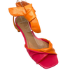 The soft leather and medium block heel make these little sandals a comfortable summer option. The twisted front and soft tie at the ankle are flattering features. Colours available are two-toned orange and fuchsia and a bright green. Made in Brazil.