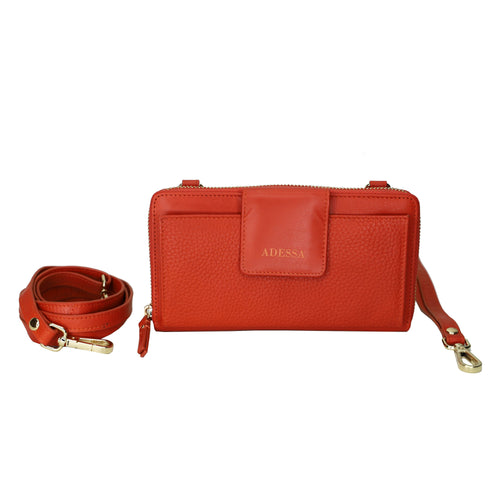 A lovely soft leather clutch, wallet or crossbody with ample card space, zip closure to the main body of the bag, outside zip and a front space with a flap for to keep your phone handy. A wrist is included along with a longer strap for shoulder or crossbody use. Measures 19cm x 10.5cm.  Comes boxed. Made by Adessa.