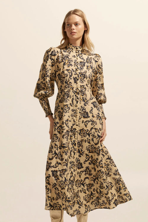 An elegant and vibrant piece defined by a refined simplicity. This midi dress, commences with a seamed bodice before descending into a flattering a-line skirt. Crafted in our signature print linen, the Crave will carry you from work to event with feminine ease.    Color: Ochre floral