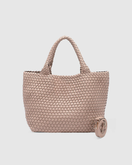 The Louenhide Cruiser Woven Tote Bag is the epitome of laid-back elegance. Designed with a woven vegan leather exterior in a classic boxy tote bag style, this casual woven bag will add the perfect touch of texture to your everyday look. Simply carry by the comfortable top handles or attach the adjustable crossbody strap for a hands-free moment when strolling around town.