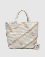 The Louenhide Cruiser Woven Tote Bag is the epitome of laid-back elegance. Designed with a woven vegan leather exterior in a classic boxy tote bag style, this casual woven bag will add the perfect touch of texture to your everyday look. Simply carry by the comfortable top handles or attach the adjustable crossbody strap for a hands-free moment when strolling around town.