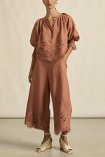 100% linen finished in a tonal spring hue
bespoke embroidered hem and sleeve in floral motif
tuck detailing around the neckline for a soft drape
elbow-length blouson sleeve with elastic cuff
rounded with a delicate button feature