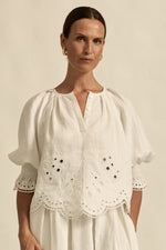  fresh approach to volume and texture, the dawn top offers bespoke embroidered artistry in a tonal hue.

100% linen finished in a tonal spring hue
bespoke embroidered hem and sleeve in floral motif
tuck detailing around the neckline for a soft drape
elbow-length blouson sleeve with elastic cuff
rounded with a delicate button feature
