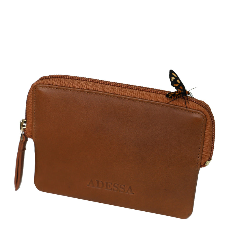 This very handy little leather coin purse will slip easily into your smallest bag or pocket. It has zip closure and also an outside zip, plenty of room for your cash as well as space for your cards. Measures 14cm x 11cm. Made by Adessa.