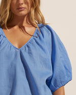 A deep gathered ‘v’ neckline and short raglan sleeve create elegant drama in this simple yet stylish pièce. Wear yours with your favourite denim or linen for an effortless yet enviable aesthetic.     composition: 100% ramie deep gathered ‘v’ neckline short raglan sleeve high-low hemline Lightweight with a relaxed fit the Element is the perfect spring go-to style. 