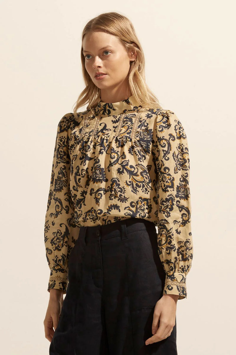 Proud and polished the Faze top delivers effortless sophistication for the modern woman. A high neckline is trimmed with feminine ladder lace, and a gathered sleeve and gathered cuff features add to its appeal. A modern and essential classic.    Colour: Ochre Floral