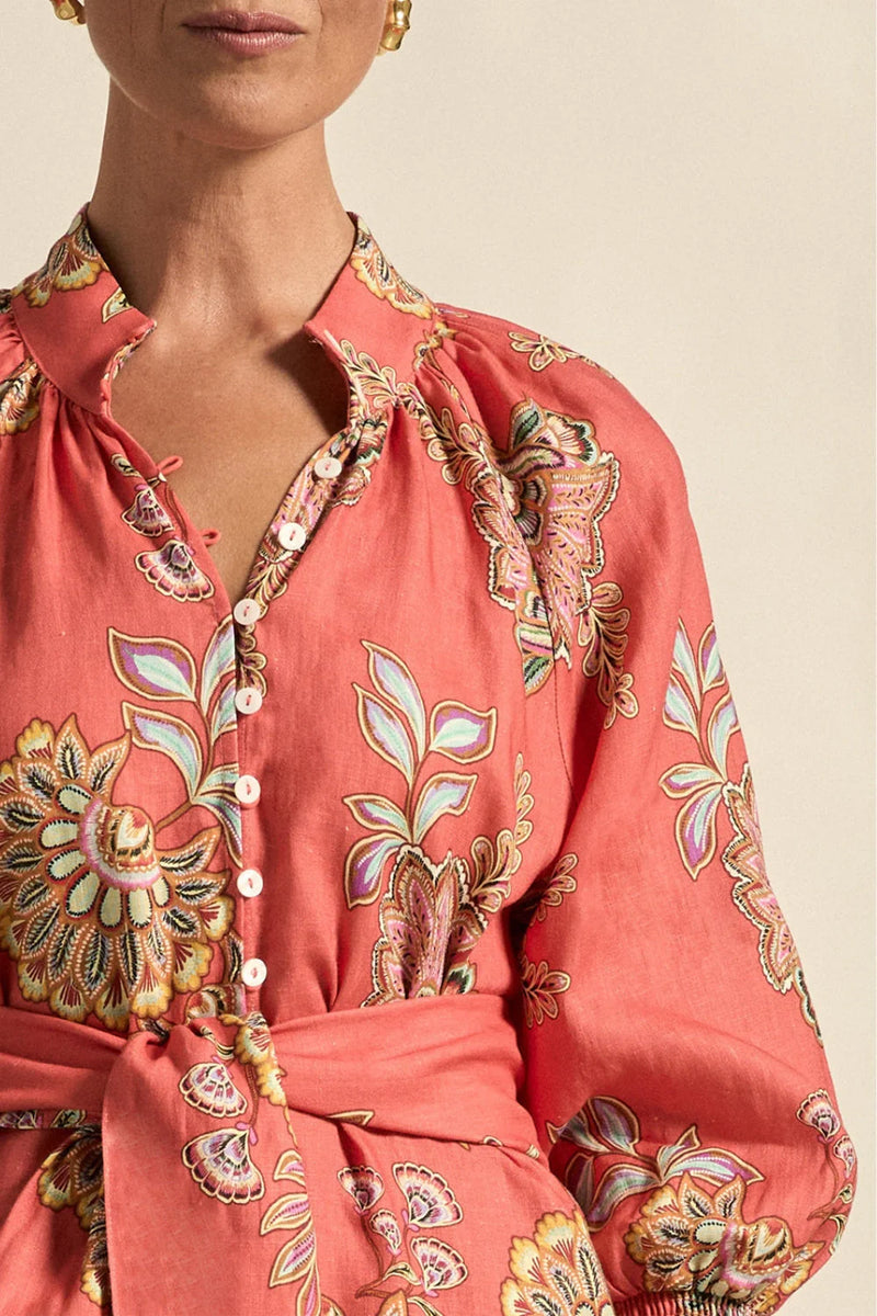 crafted in pure linen, it pairs tailored notes with natural flow—ideal for warm weather and versatile wear.
• 100% lightweight linen for breathability
• rounded high stand collar with shell button detail
• 3/4 blouson sleeve with elastic cuff
• wide self-tie belt offers versatile shaping
• relaxed silhouette with side split for ease of movement
• effortless for daywear, polished for occasion