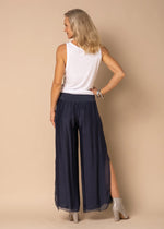 The Gia pant is a long romantic flowing pants with a mid-calve slit up the outer leg. It is made from delicate, silk. The wrap waistband is elasticized and stays flat to offer a lovely figure-flattering shape. You no longer do you need to sacrifice comfort for style!  Material - 100% Silk Outer  Designed In Australia