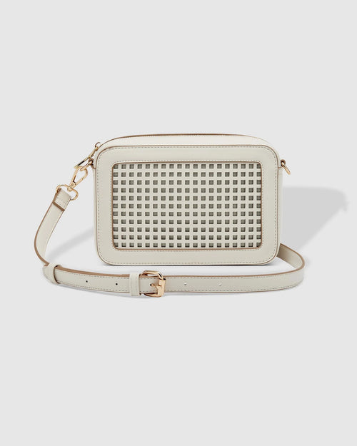 The Louenhide Giselle Crossbody Bag is designed to elevate your everyday style, with its classic camera bag shape and subtle yet impactful features. Add a touch of textural intrigue to your look with the square lattice inspired panel detailing, transforming a classic silhouette into a style statement, ideal for any occasion. Redefine your look with this everyday women’s crossbody bag that effortlessly blends practicality with sophistication.