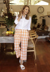The gorgeous apricot gingham 100% linen looks wonderful in these pants. The wide elasticised waist also has drawstring. Wear these with our plain white cable knit top, the apricot linen shirt or the matching gingham top.