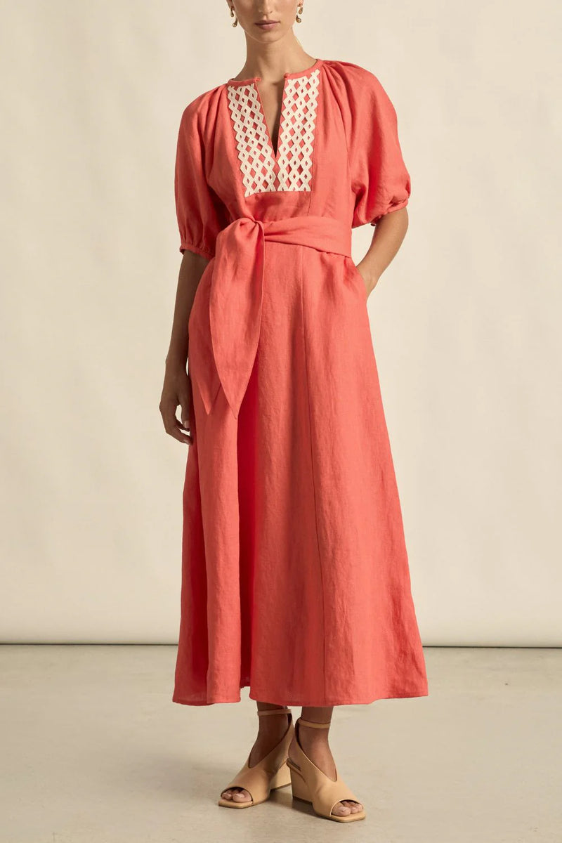 laxed yet refined.
• crafted in 100% linen
• fit-and-flare maxi silhouette
• v-split neckline with bound finish
• raglan 3/4 sleeve with gathered volume
• wide self-fabric belt with angled ends
• lace panel at bib for artisanal appeal
• centre back zip for clean closure
• ideal for travel, leisure, or warm days ahead