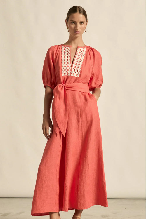 laxed yet refined.
• crafted in 100% linen
• fit-and-flare maxi silhouette
• v-split neckline with bound finish
• raglan 3/4 sleeve with gathered volume
• wide self-fabric belt with angled ends
• lace panel at bib for artisanal appeal
• centre back zip for clean closure
• ideal for travel, leisure, or warm days ahead
