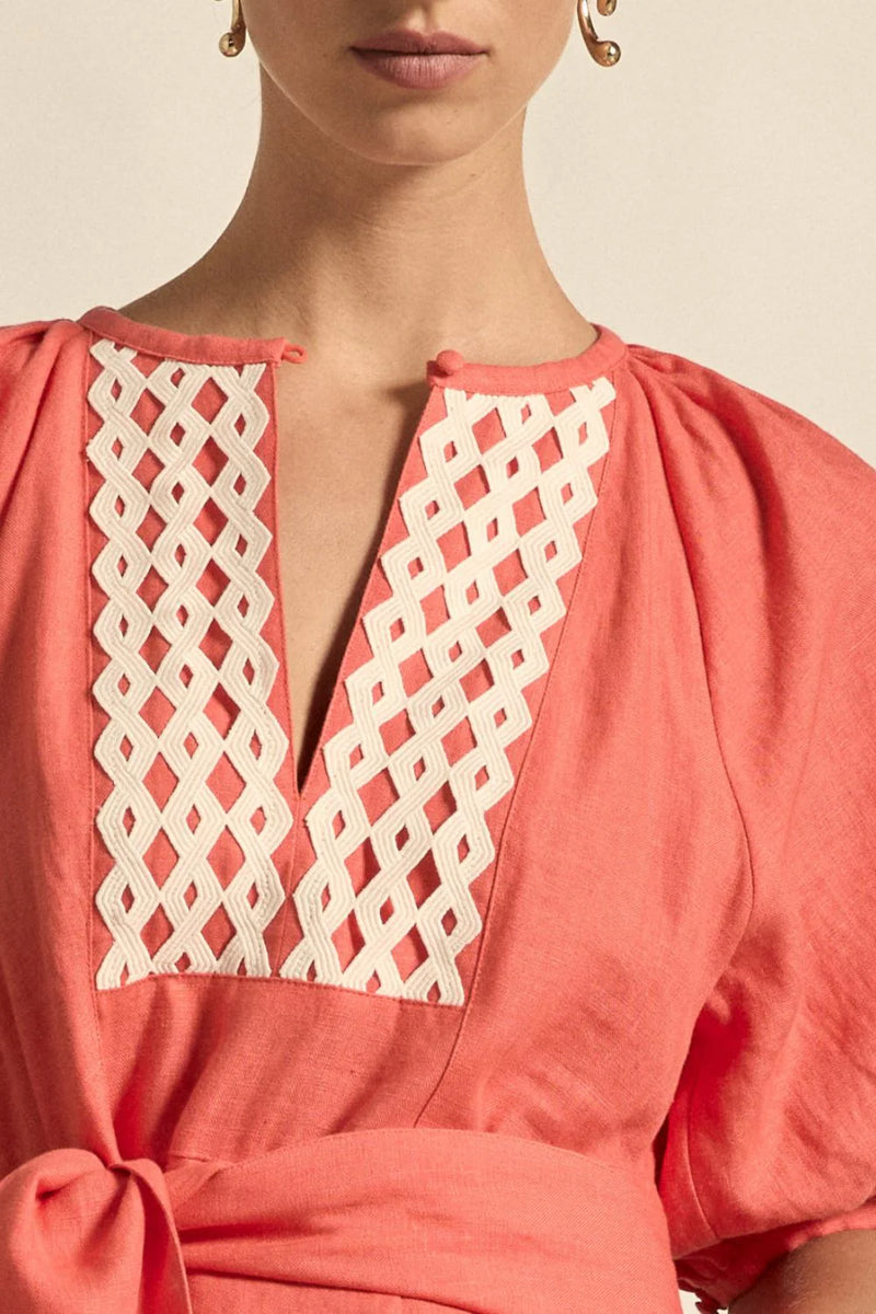 laxed yet refined.
• crafted in 100% linen
• fit-and-flare maxi silhouette
• v-split neckline with bound finish
• raglan 3/4 sleeve with gathered volume
• wide self-fabric belt with angled ends
• lace panel at bib for artisanal appeal
• centre back zip for clean closure
• ideal for travel, leisure, or warm days ahead