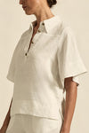 crafted in 100% linen
crisp collar offers structure and sophistication
flutter sleeve adds subtle volume and movement
brass domed buttons for modern polish
refined, versatile style perfect for effortless layering
pair with the apex pant in porcelain for trans-seasonal styling