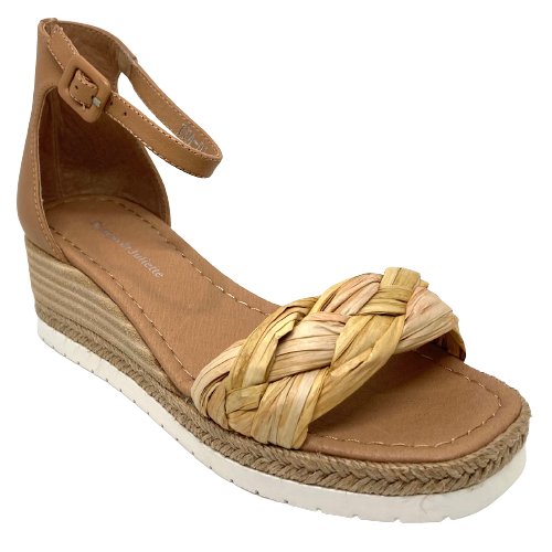 Here's a handy versatile little summer wedge. Easy to match tan leather is used in the heel cup and ankle strap and the front strap is a wide, chunky band of neutral colours of plaited raffia. A stacked leather wedge with a band of plaited hessian and white rubber sole finishes this sandal of beautifully.