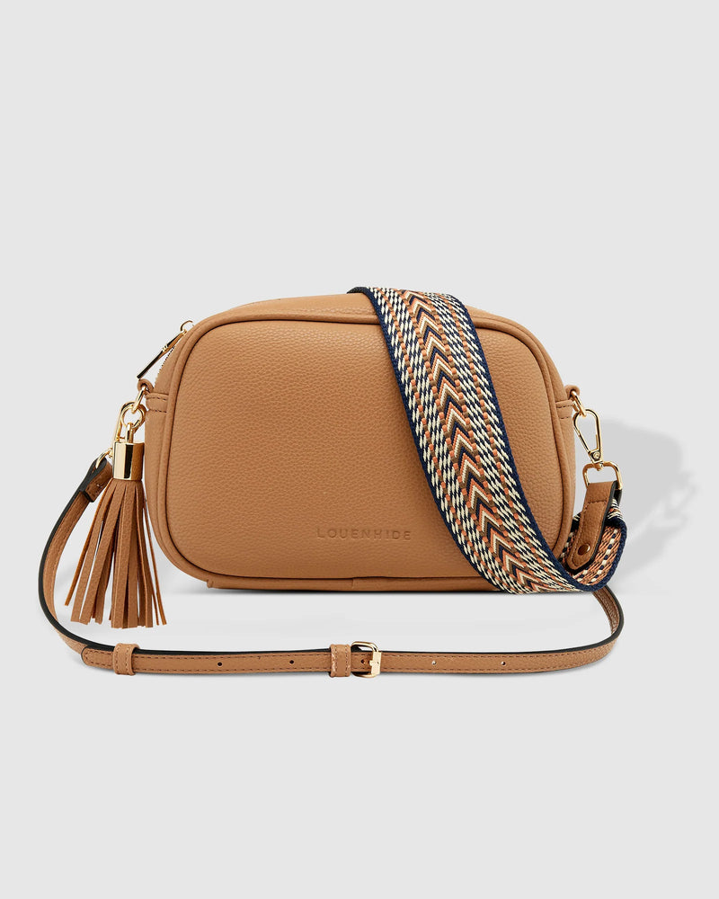 1440 × 1800px  The Louenhide Jacinta Crossbody Bag is the ultimate cool-girl bag, featuring a complimentary detachable guitar strap. feel luxe and sporty with our Jacinta over your shoulder. Walk out in style with a fun tassel feature and secure your essentials with its slip and zip pockets. Available in a range of classic & preppy colours and designed to style effortlessly with your daily wardrobe.