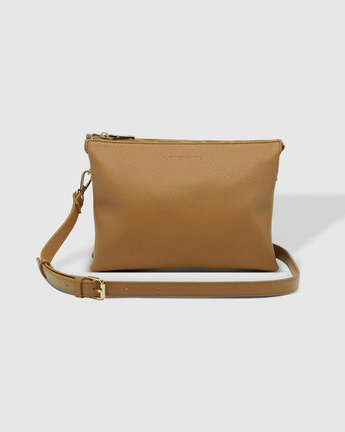 The Louenhide Josie Crossbody Bag is a timeless and functional everyday bag, designed to keep you organised and stylish throughout your day. Divided into three functional compartments, this casual crossbody bag provides the perfect solution for keeping your essentials neatly organised. Finished in a smooth vegan leather exterior, this women's crossbody bag is ready to withstand daily wear and tear, ensuring it remains a reliable companion. 