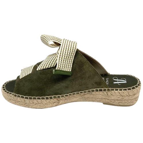 Made in Spain by Juncal Aguirre this suede espadrille slide has an adjustable front made possible by a wide flat lacing over the instep. The leather comes well back on the foot giving good support.