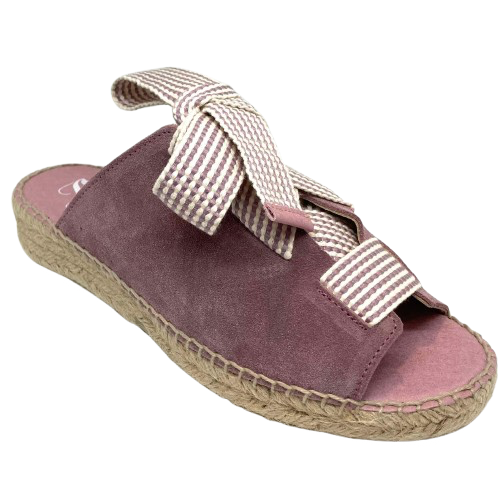 Made in Spain by Juncal Aguirre this suede espadrille slide has an adjustable front made possible by a wide flat lacing over the instep. The leather comes well back on the foot giving good support.