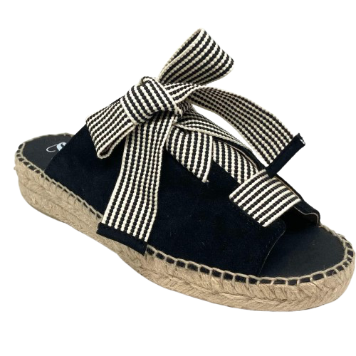 Made in Spain by Juncal Aguirre this suede espadrille slide has an adjustable front made possible by a wide flat lacing over the instep. The leather comes well back on the foot giving good support.