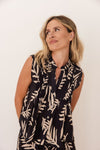 This sleeveless little top is made of soft 100% cotton, has a buttoned through front and pintucking. It can be worn either tucked into pants (there are matching wide leg pants available) or left to hang out. Made by Seesaw.
