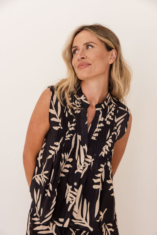 This sleeveless little top is made of soft 100% cotton, has a buttoned through front and pintucking. It can be worn either tucked into pants (there are matching wide leg pants available) or left to hang out. Made by Seesaw.