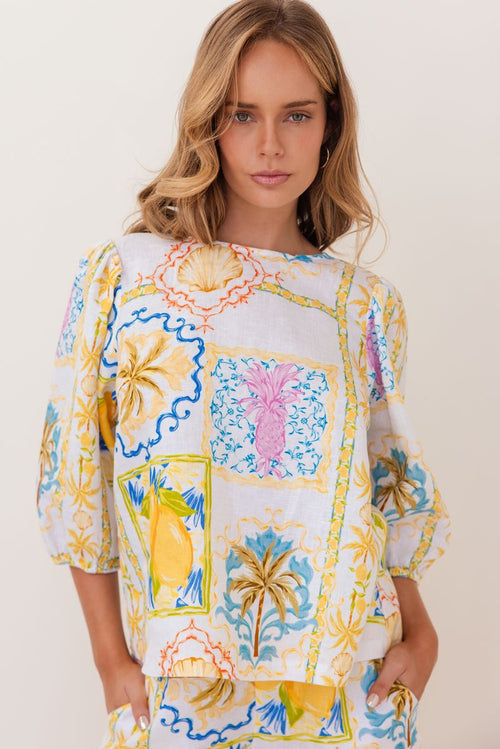 100% linen in the fresh Amalfi Print of lemons and blues is in this sweet little top with it's elbow length sleeve.
