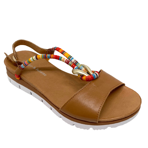  A super soft tan summer sandal that's been jazzed up with a multi coloured strap with a touch of gold. This little low wedge has a moulded insole and a white rubber outer sole providing comfort in a shoe you'll want to wear every day. Made by Django & Juliette.