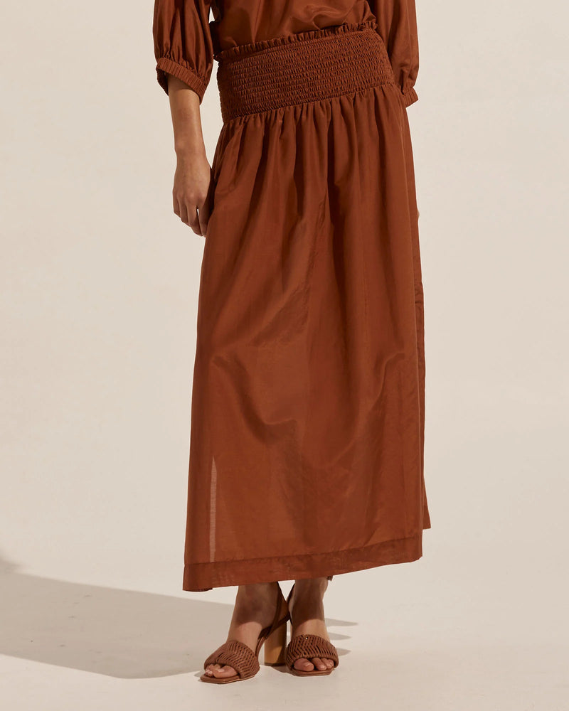 Luxe and modern the Luna is the ideal spring/summer skirt. Crafted in a cotton and silk blend it is youthful and chic. A shirred waist is flattering and comfortable. Side splits add movement and flair. Wear yours with the matching siesta top for statement style. 