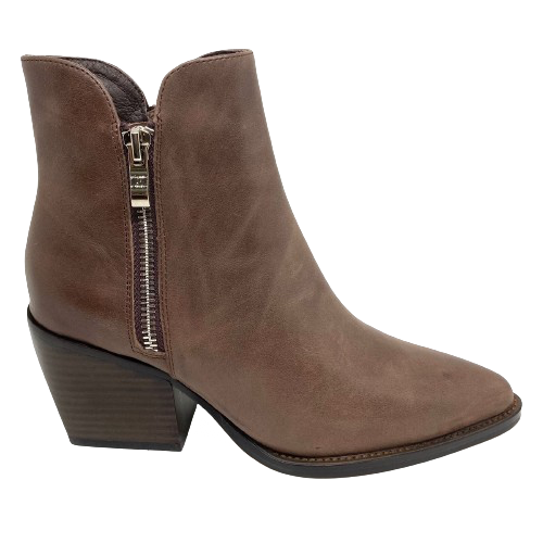 The rich chocolate coloured leather used in this classic boot will work beautifully with your winter wardrobe. The 7cm stacked heel has a slightly western feel to it, the toe shape is nicely tapered and it finishes at the ankle with a dip at either side where there are double zips for ease of entry. This little boot from Django &amp; Juliette will suit both pants and skirts with style.