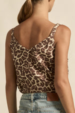 your essential layering piece - refined and ready for summer.

100% linen
wide-set straps for ease and wearability
v-neckline adds a flattering touch
perfect alone or layered under jackets
crafted in the zk exclusive ocelot print, a neutral take on the classic leopard trend.
