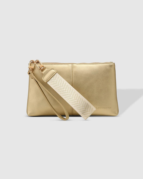 1600 × 2000px  The Louenhide Mimi Clutch is your new everyday staple. Where elegance meets functionality, this compact silhouette can effortlessly transform your style from day to night. Style and wear the webbing wristlet for a more casual everyday look, or interchange for the matching vegan leather wristlet to elevate your night out attire. Made from a smooth vegan leather, this casual women's clutch offers ample space fit for all your everyday essentials.