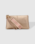 1600 × 2000px  The Louenhide Mimi Clutch is your new everyday staple. Where elegance meets functionality, this compact silhouette can effortlessly transform your style from day to night. Style and wear the webbing wristlet for a more casual everyday look, or interchange for the matching vegan leather wristlet to elevate your night out attire. Made from a smooth vegan leather, this casual women's clutch offers ample space fit for all your everyday essentials.