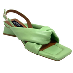 Made in Spain these low sandals have an interesting triangle shaped heel with a slingback and two soft, wide, padded leather straps across the front of the foot. The footbed is also padded and soft so it's a comfortable sandal that can be worn as a dressy shoe or dressed down for a more casual occasion. Available in soft pistachio green and a pale putty colour.