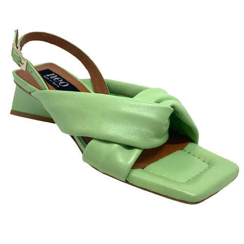Made in Spain these low sandals have an interesting triangle shaped heel with a slingback and two soft, wide, padded leather straps across the front of the foot. The footbed is also padded and soft so it's a comfortable sandal that can be worn as a dressy shoe or dressed down for a more casual occasion. Available in soft pistachio green and a pale putty colour.