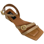 Made in Spain by Neo this gorgeous sandal in a beautiful neutral shade of camel and with its cute little 4.5cm heel will take you many places. The well placed straps are of raffia (with leather lining) and have a small "horn" buckle at the top of the foot and at the ankle.