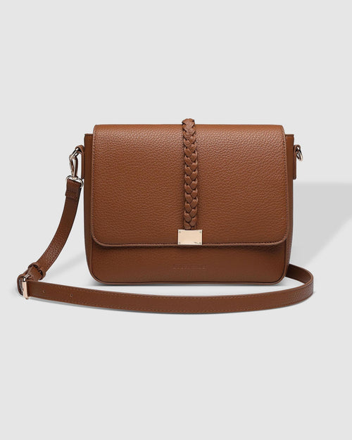 The Louenhide Ness Crossbody Bag is a versatile and stylish everyday accessory ready to take you on your daily adventures. Whether you are navigating a bustling day or heading out for a casual lunch, this large crossbody bag effortlessly transitions through your day-to-day life. Featuring neutral tones and a gorgeous, braided detail, this women's casual crossbody bag will pair seamlessly with your autumn wardrobe. 