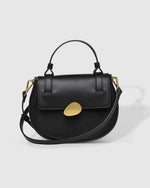 The Louenhide Octavia Suede Crossbody Bag is the perfect statement accessory to wear to your next event. Embrace the winter season with a classic crossbody bag that effortlessly complements your style, no matter the occasion. Add a touch of texture and sophistication to your look with the rounded silhouette, enhanced by brushed gold hardware accents.