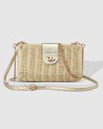 The Louenhide Ophelia Raffia Crossbody Bag is an effortlessly luxe, structured crossbody, perfect for summer evenings. Adding a touch of luxury, the metallic vegan leather creates a harmonious fusion of textures that is sure to turn heads. Opening effortlessly to reveal a spacious interior, this luxe women’s crossbody bag, allows you to organise your summer necessities while keeping them secure with the turn lock closure. 