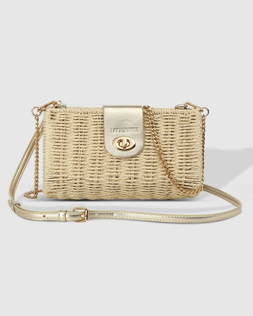 The Louenhide Ophelia Raffia Crossbody Bag is an effortlessly luxe, structured crossbody, perfect for summer evenings. Adding a touch of luxury, the metallic vegan leather creates a harmonious fusion of textures that is sure to turn heads. Opening effortlessly to reveal a spacious interior, this luxe women’s crossbody bag, allows you to organise your summer necessities while keeping them secure with the turn lock closure. 