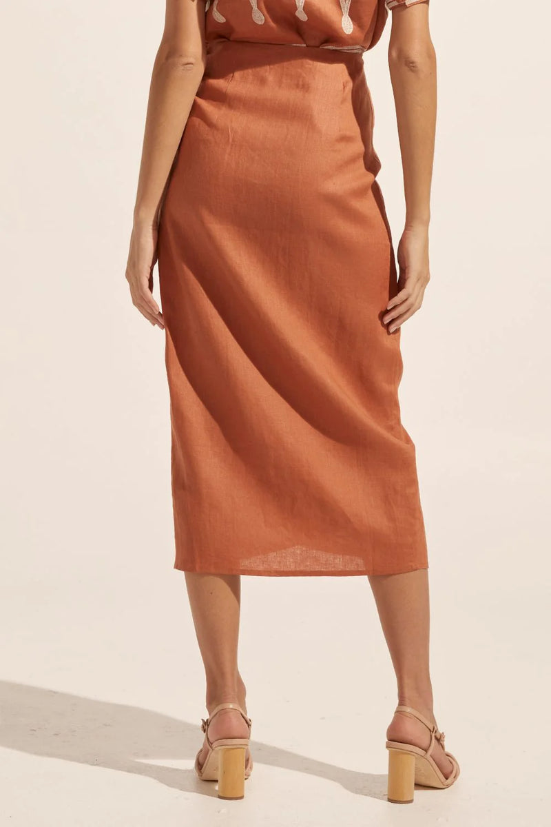 The Overflow skirt offers a flattering wrap design that is an on-trend essential for summer. An internal button ensures a secure and bespoke fit. Wear yours with the Nomad top or over your swimsuit for a chic yet effortless solution.    Colour: Ginger