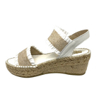 This tried and proven favourite espadrille has a 7cm rope wedge and the wide elasticized straps are finished with a small frill. A well fitted and comfortable sandal. Made in Spain.